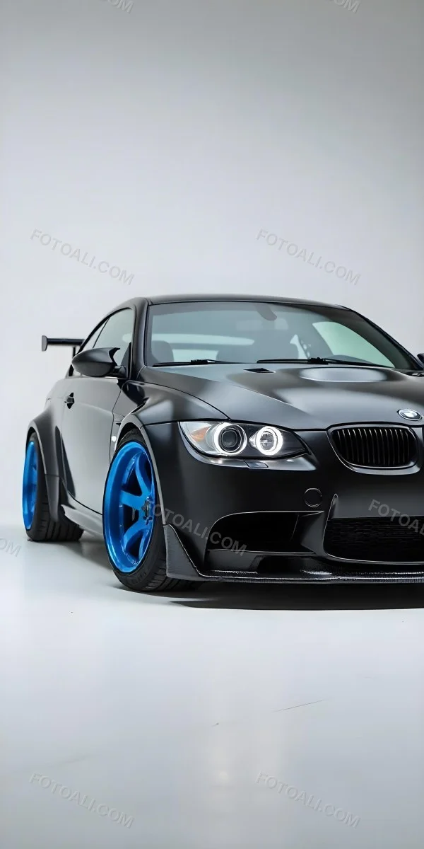 A Black Bmw M3 E92 With A Wide Body Kit Blue Rims And A Carbon Fiber Front Lip Studio Background 26 0e86