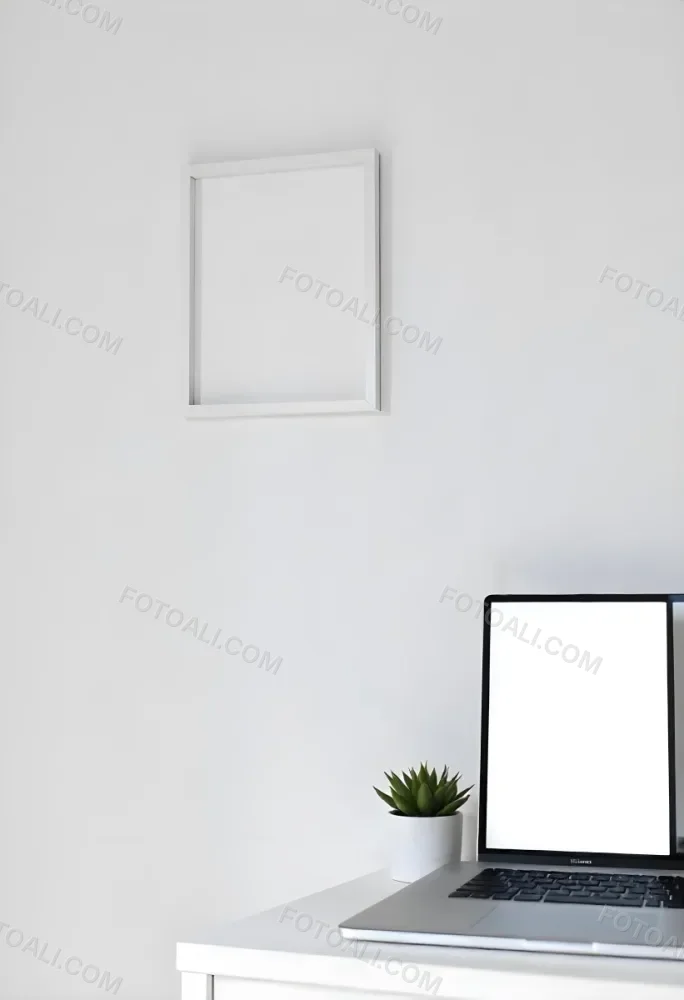 A Black Picture Frame On A White Wall With A Small Potted Plant In The Foreground 1 D21a