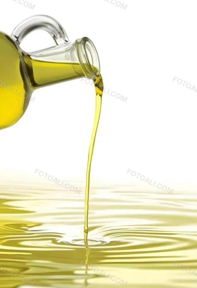 A Bottle Pouring Yellow Liquid Creating A Splash And Ripple Effect In The Water 5 Cb3e