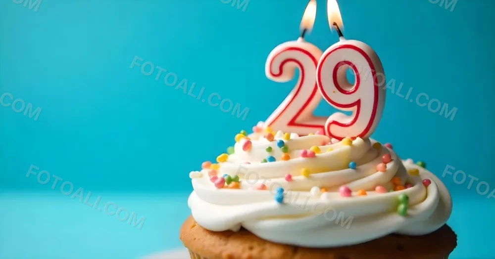 A Cake With White Frosting And Colorful Sprinkles Topped With A Candle In The Shape Of The Number 29 Blue Background 29 Fa75