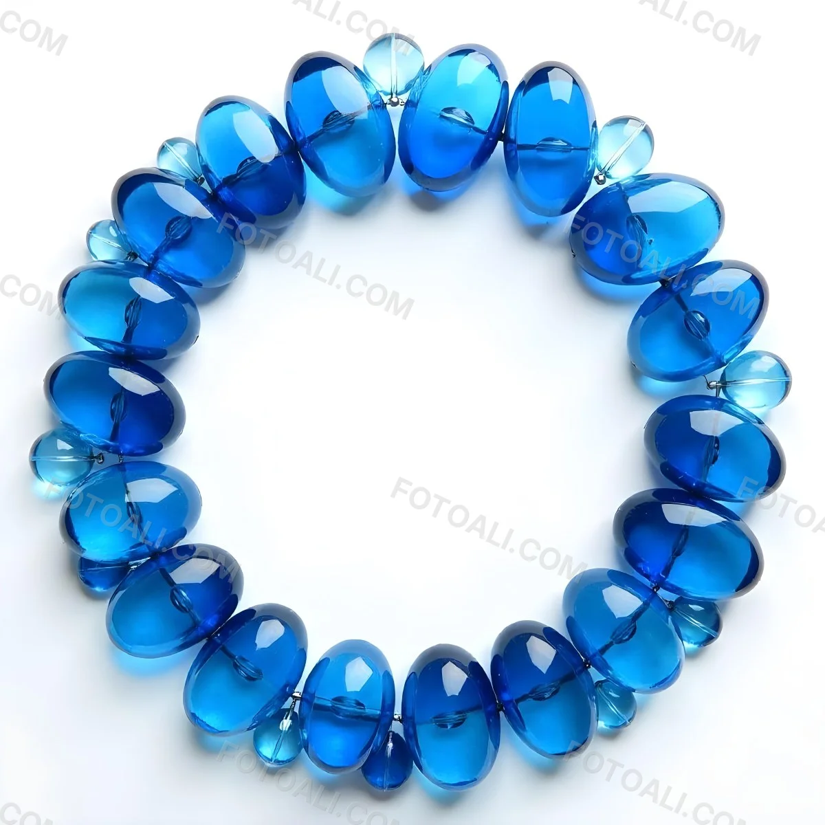 A Circular Arrangement Of Blue Gemstones Or Beads Against A White Background 3 948d