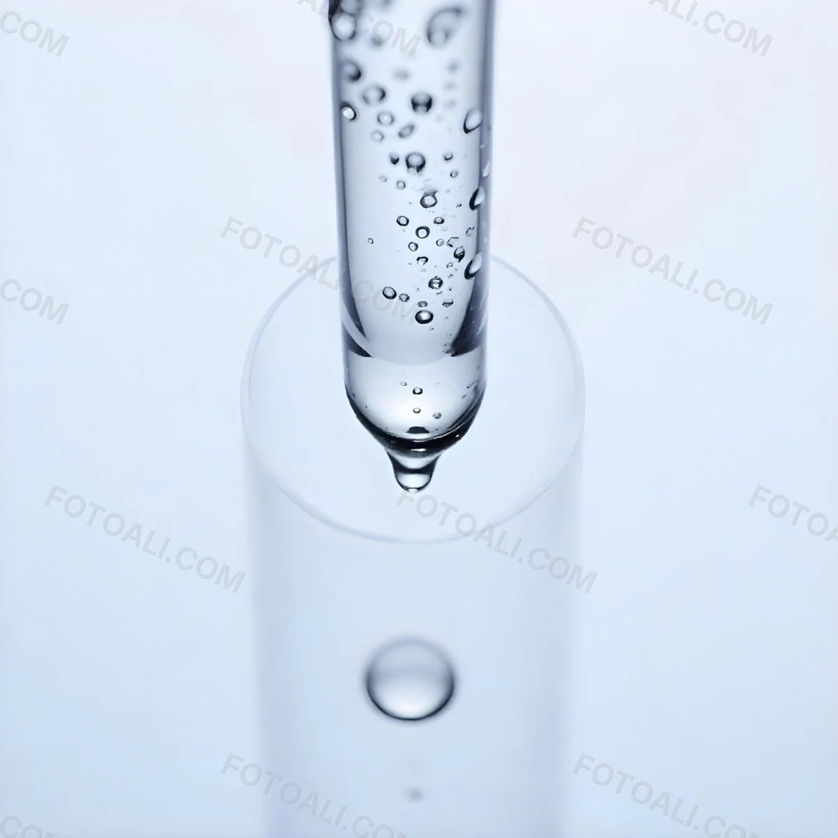 A Close Up Of A Glass Pipette With Water Droplets Against A Blue Background 1 Dfaa