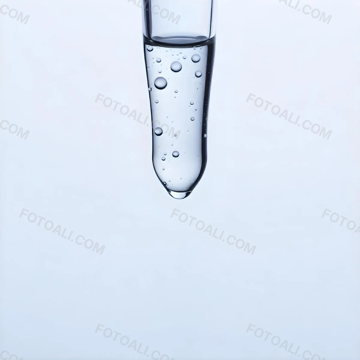 A Close Up Of A Glass Pipette With Water Droplets Against A Blue Background 3 590b