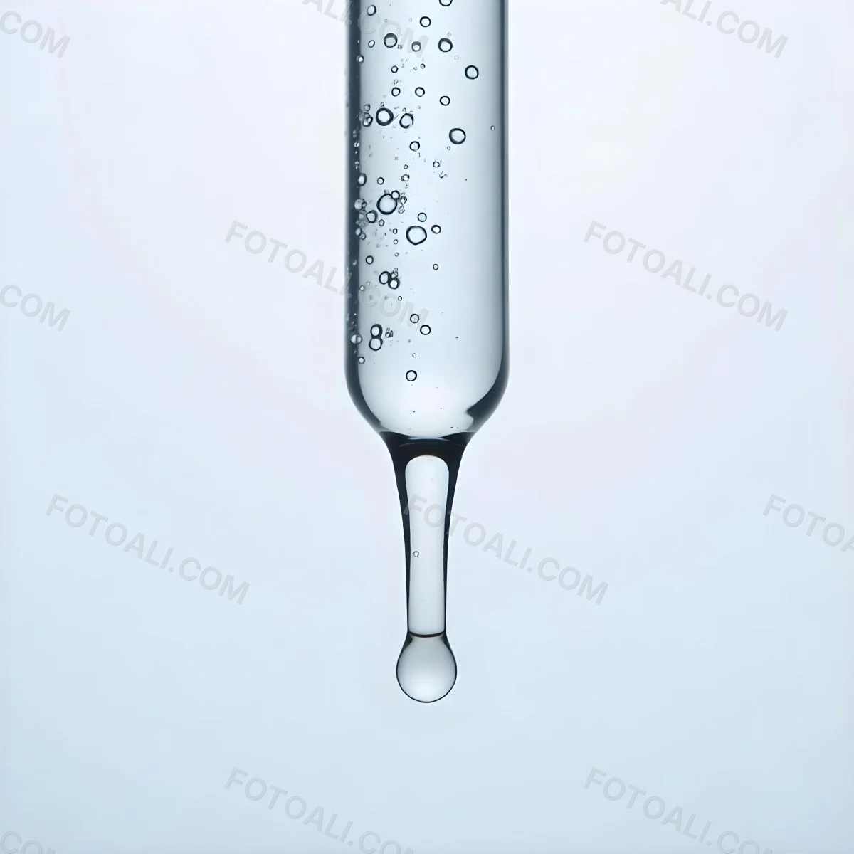A Close Up Of A Glass Pipette With Water Droplets Against A Blue Background 4 751e