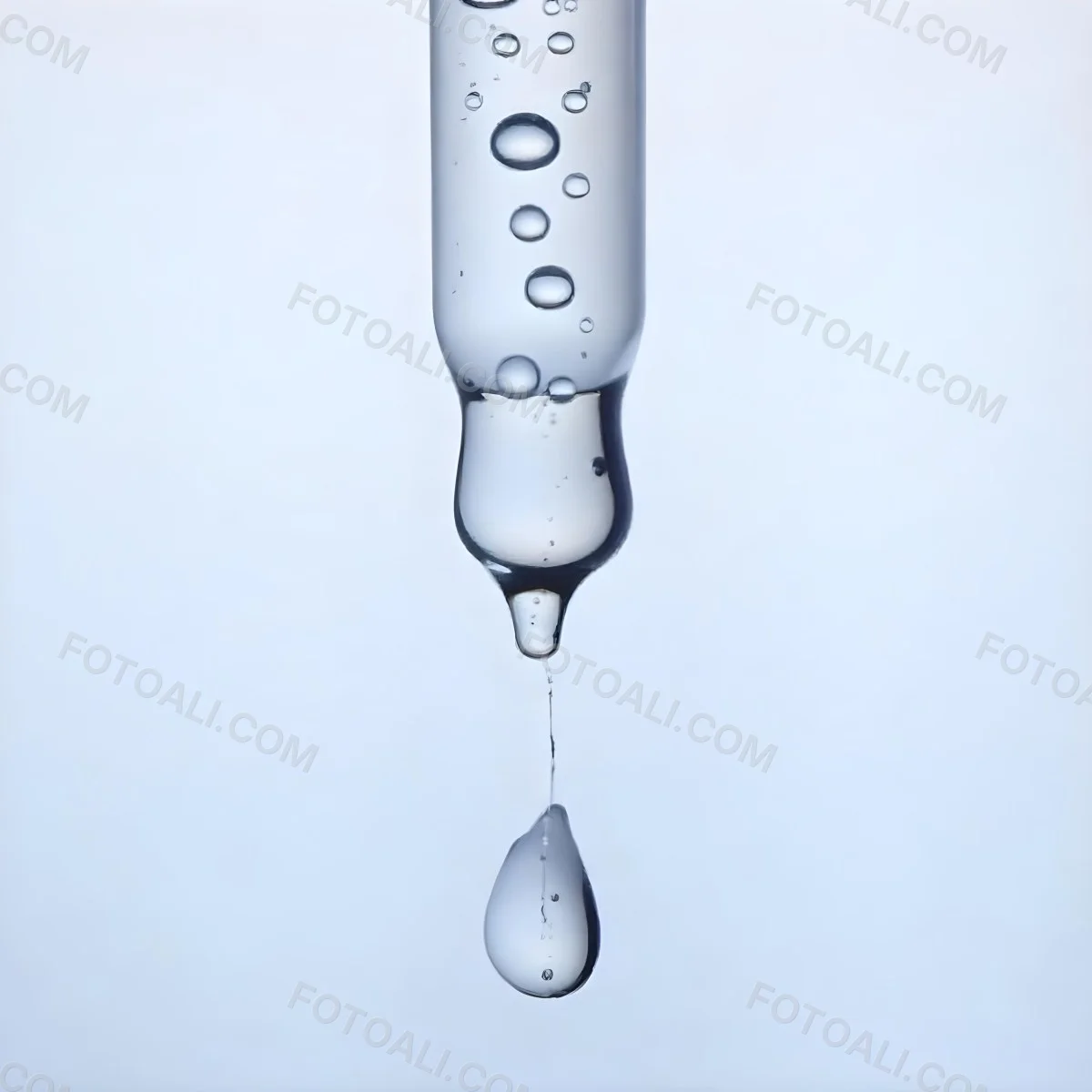 A Close Up Of A Glass Pipette With Water Droplets Against A Blue Background 5 Fbc4