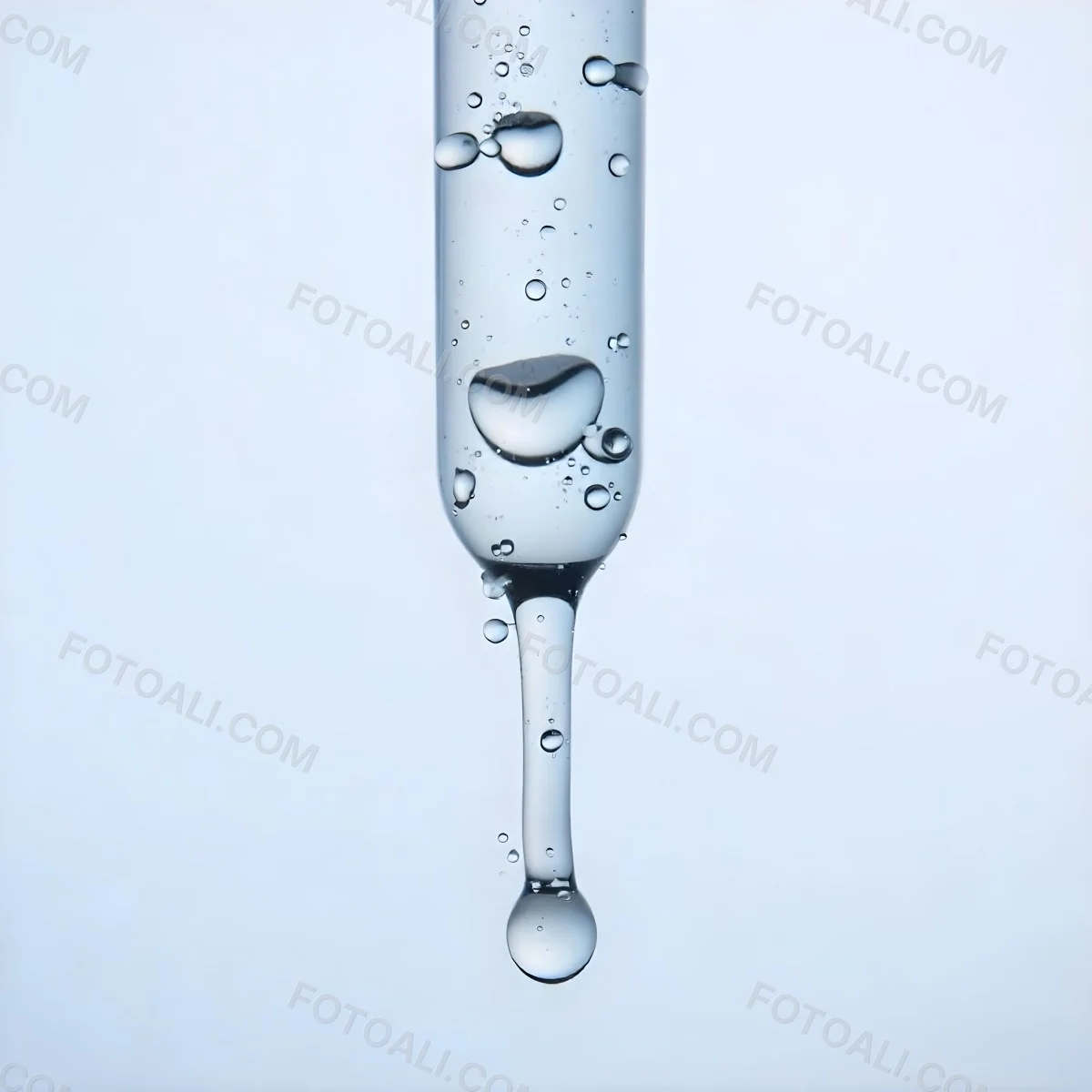 A Close Up Of A Glass Pipette With Water Droplets Against A Blue Background 7 5103
