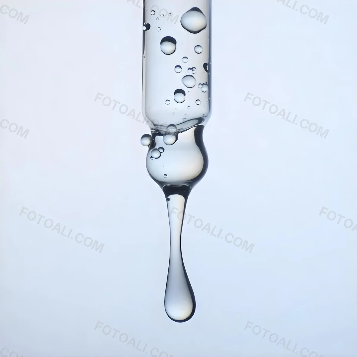 A Close Up Of A Glass Pipette With Water Droplets Against A Blue Background 9 C2f9