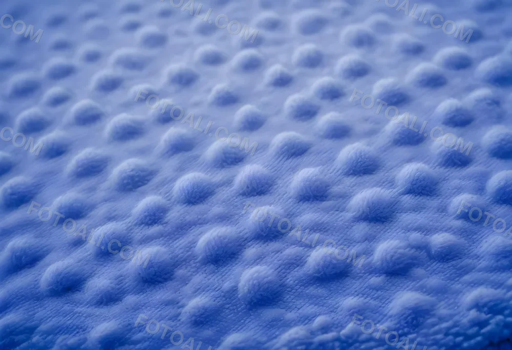 A Close Up View Of A Blue Textured Fabric Or Material With A Repeating Pattern Of Small Raised Bumps Creating A Soft Fuzzy Appearance 65 2774