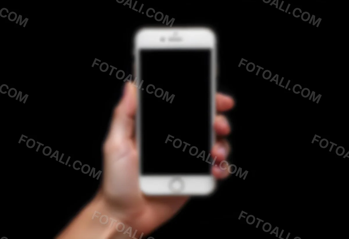 A Fair Skinned Hand Holding A White Smartphone With A Blank Black Screen Isolated On A Black Background 15 E4ad
