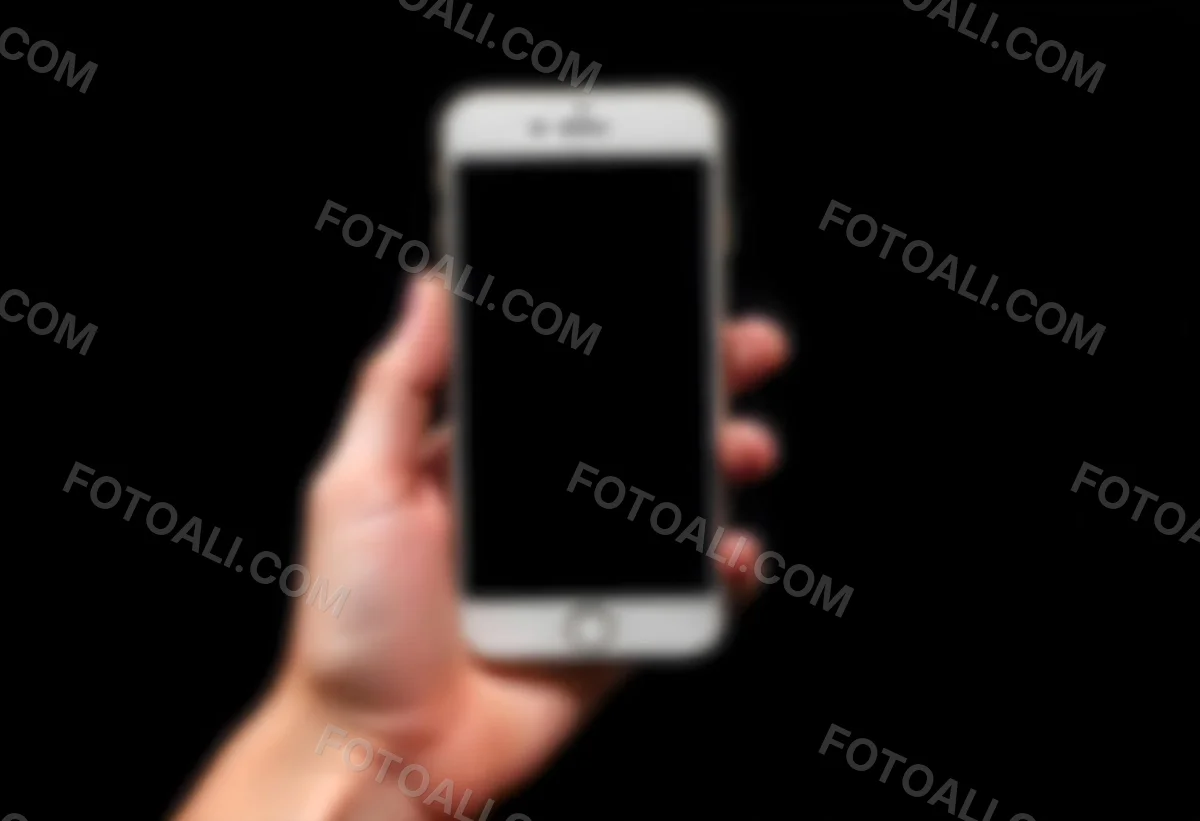 A Fair Skinned Hand Holding A White Smartphone With A Blank Black Screen Isolated On A Black Background 5 8073