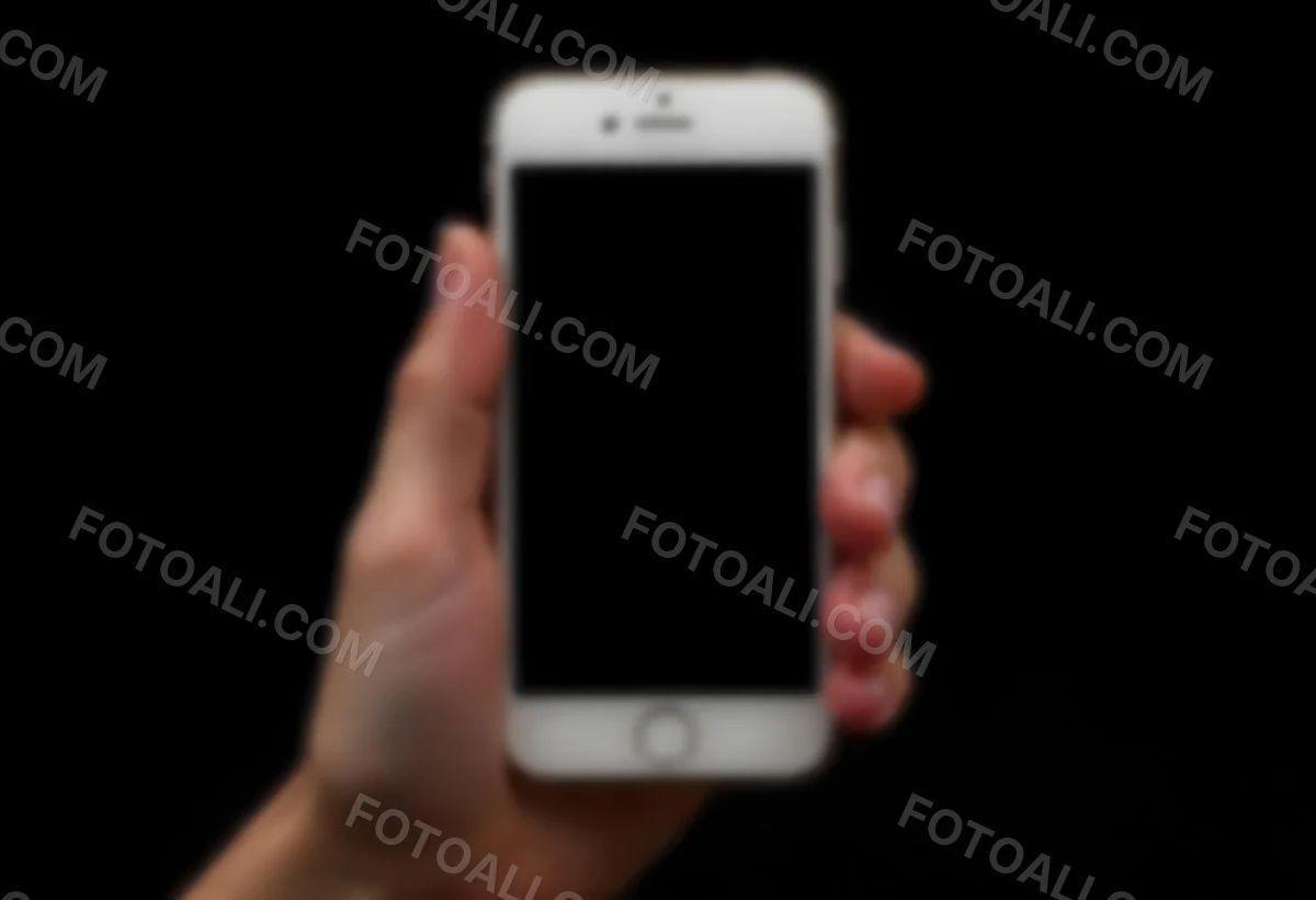 A Fair Skinned Hand Holding A White Smartphone With A Blank Black Screen Isolated On A Black Background 6 97b1