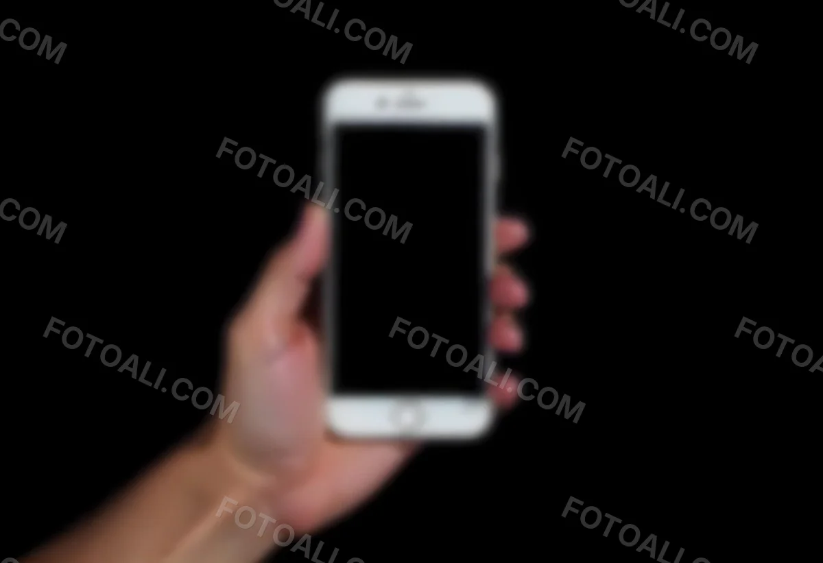 A Fair Skinned Hand Holding A White Smartphone With A Blank Black Screen Isolated On A Black Background 9 66a8