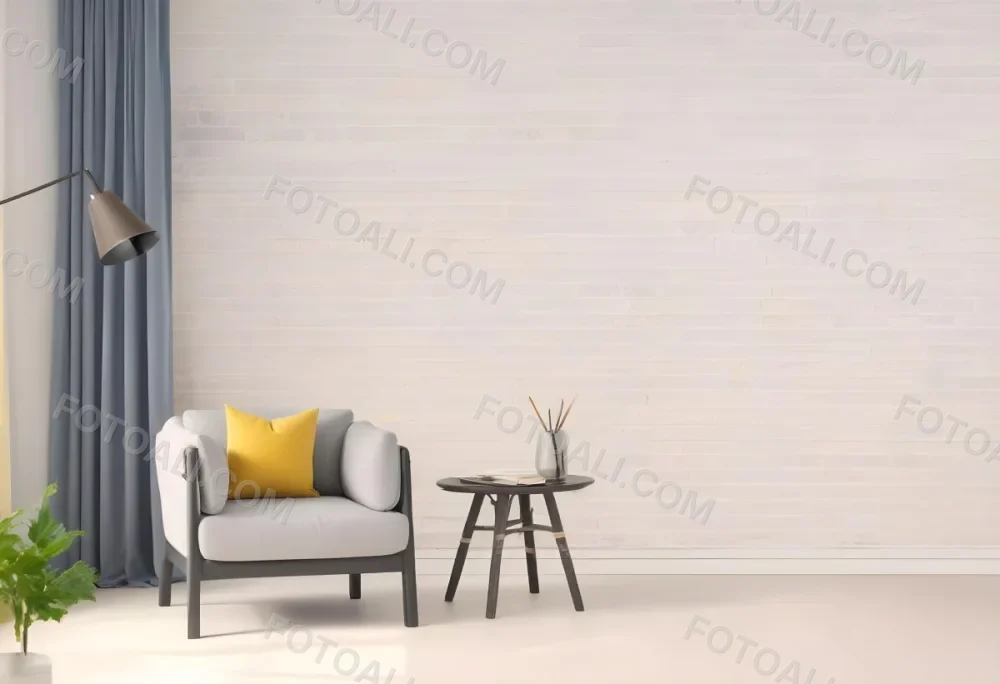 A Gray Armchair With A White Pillow Next To A Small Table With A Book And Some Sticks In A Yellow Room 5 A987