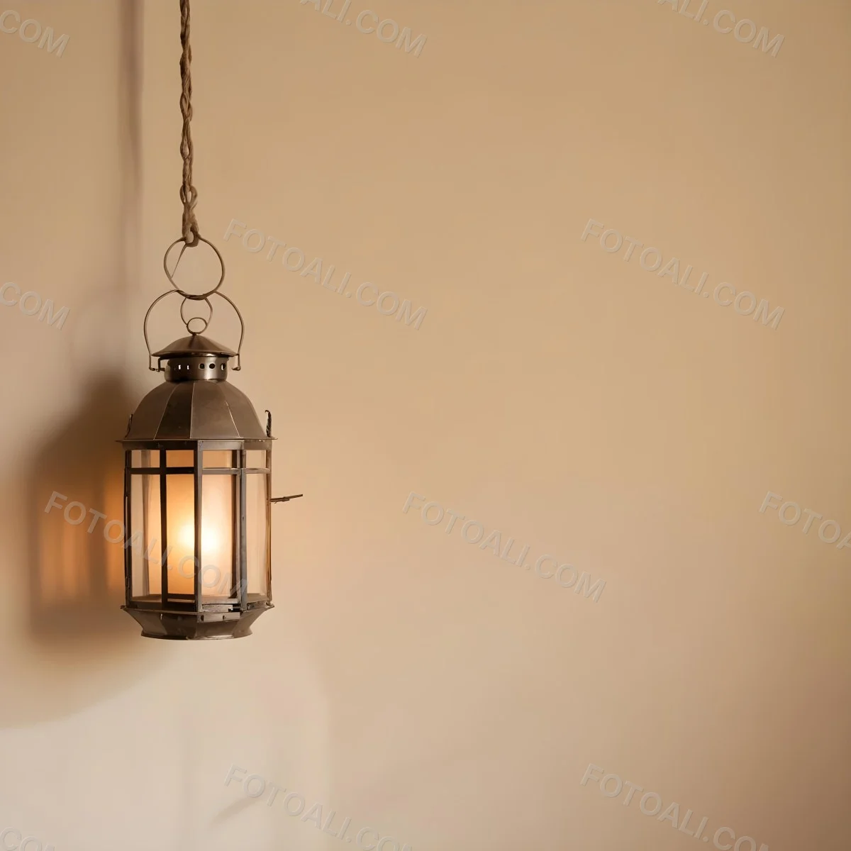 A Hanging Lantern With A Warm Glowing Light Against A Plain Beige Wall 7 8820