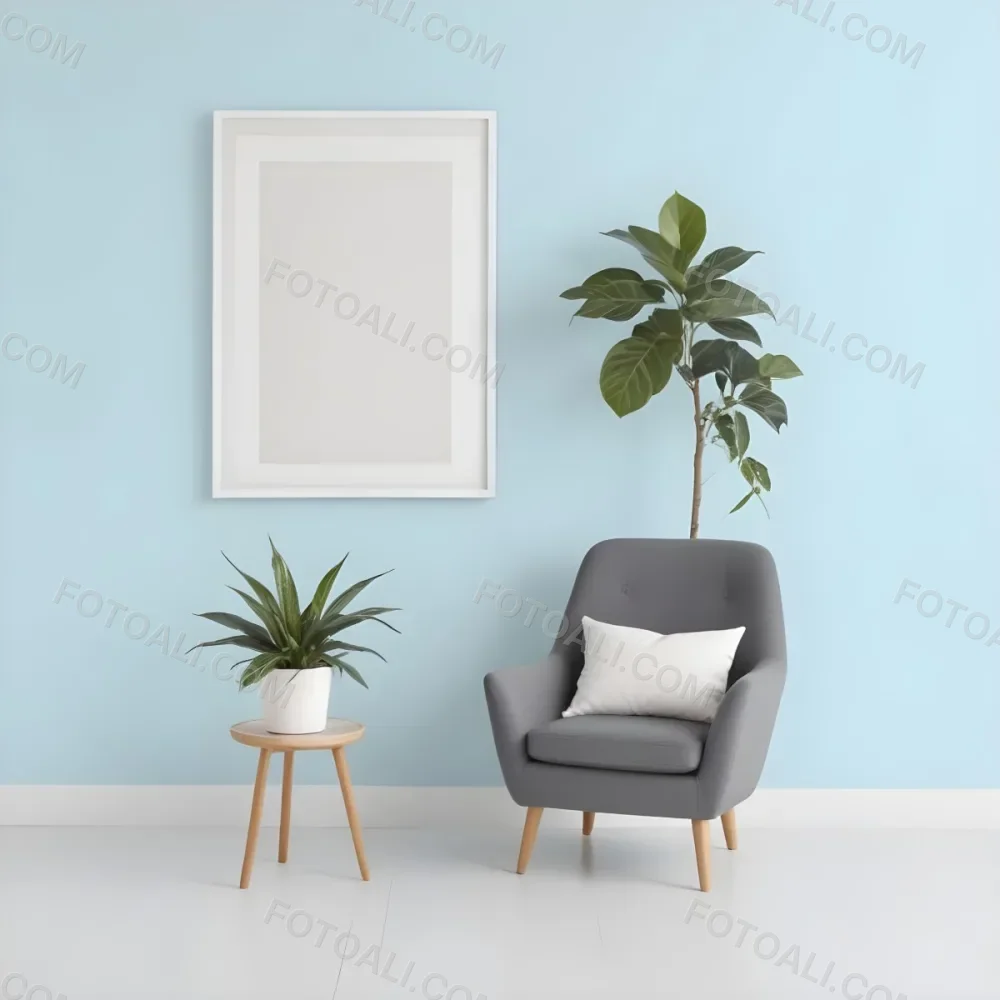 A Modern Living Room With A Gray Armchair A White Framed Wall Art And A Wooden Side Table With A Potted Plant 58 F796