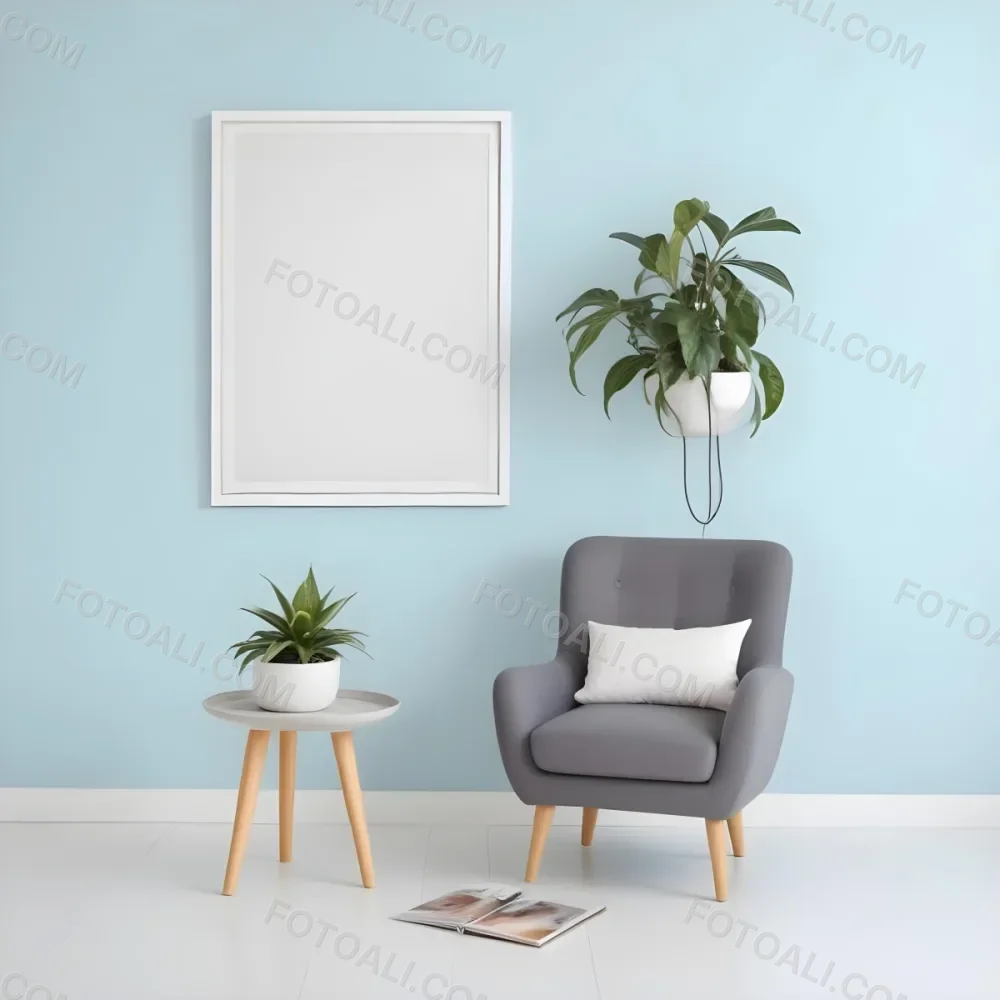 A Modern Living Room With A Gray Armchair A White Framed Wall Art And A Wooden Side Table With A Potted Plant 59 7de6