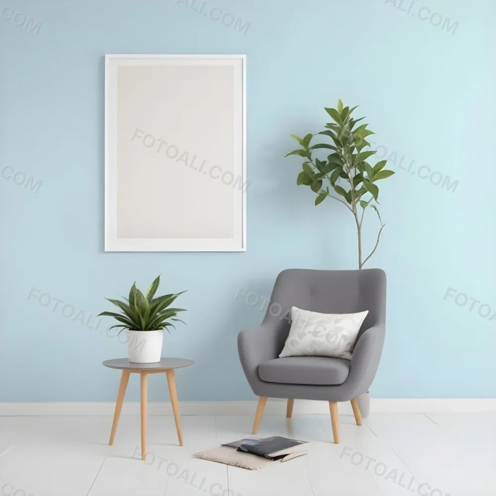 A Modern Living Room With A Gray Armchair A White Framed Wall Art And A Wooden Side Table With A Potted Plant 62 4056