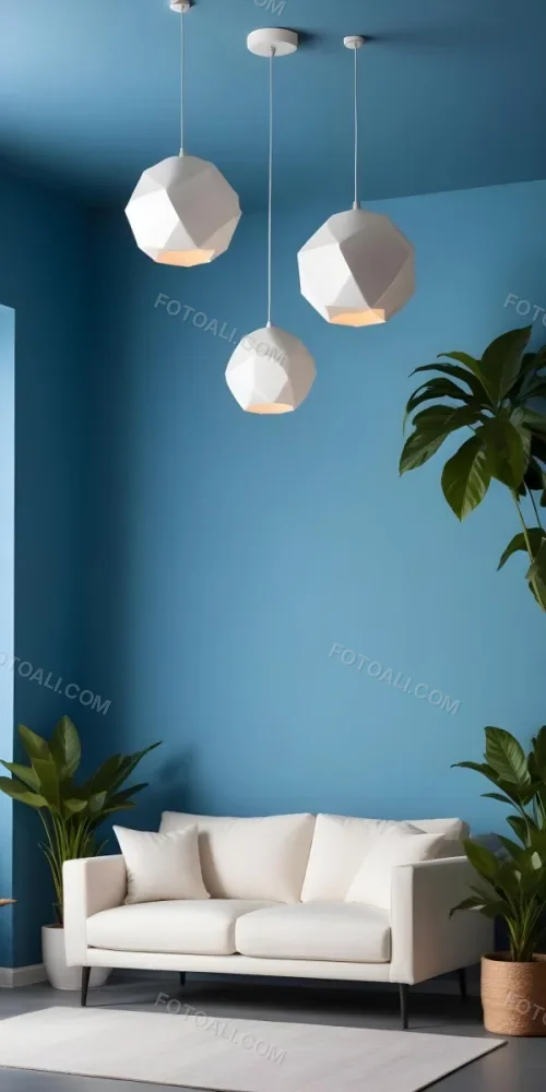 A Modern Living Room With A White Sofa A Potted Plant And Geometric Pendant Lights Hanging From The Ceiling Against A Blue Wall 23 F90f