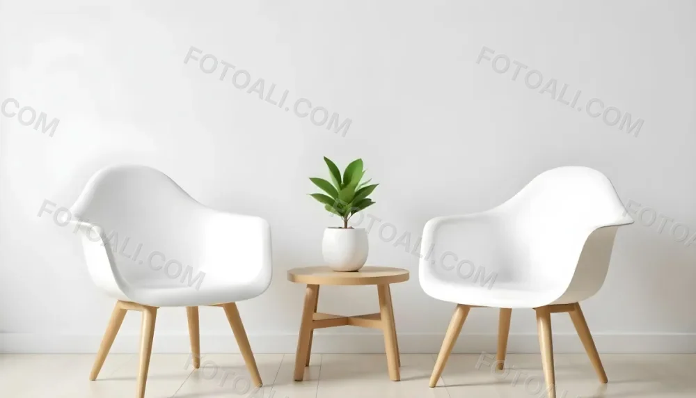 A Potted Green Plant On A Wooden Side Table Between Two White Chairs In A Minimalist Interior Setting 3 C2c5