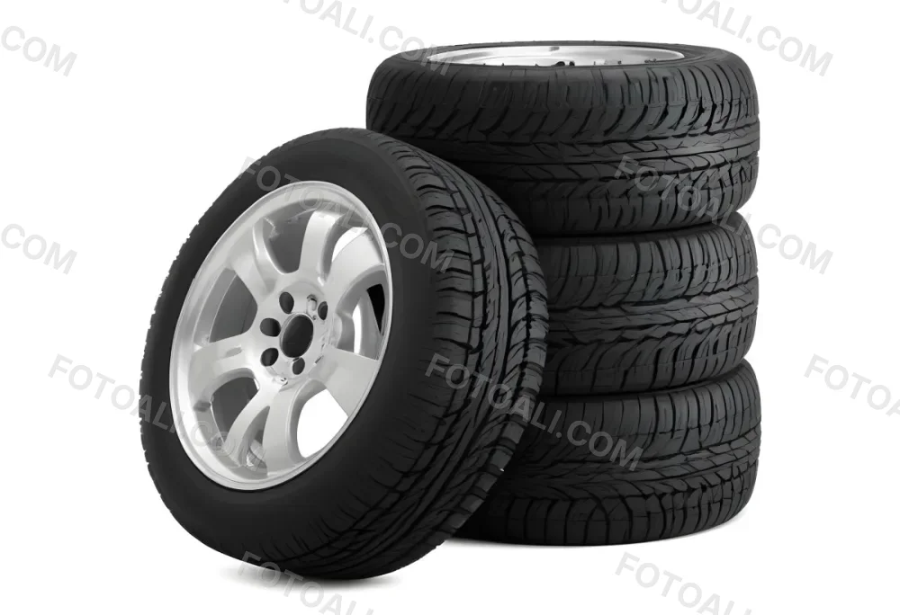 A Stack Of Four Black Tires With Black Rims One Tire Is Leaning Against The Stack The Background Is Black 14 C5f8