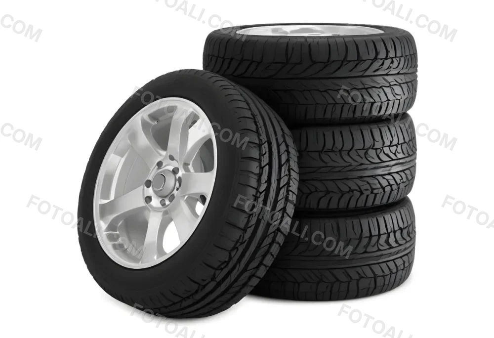 A Stack Of Four Black Tires With Black Rims One Tire Is Leaning Against The Stack The Background Is Black 7 198a