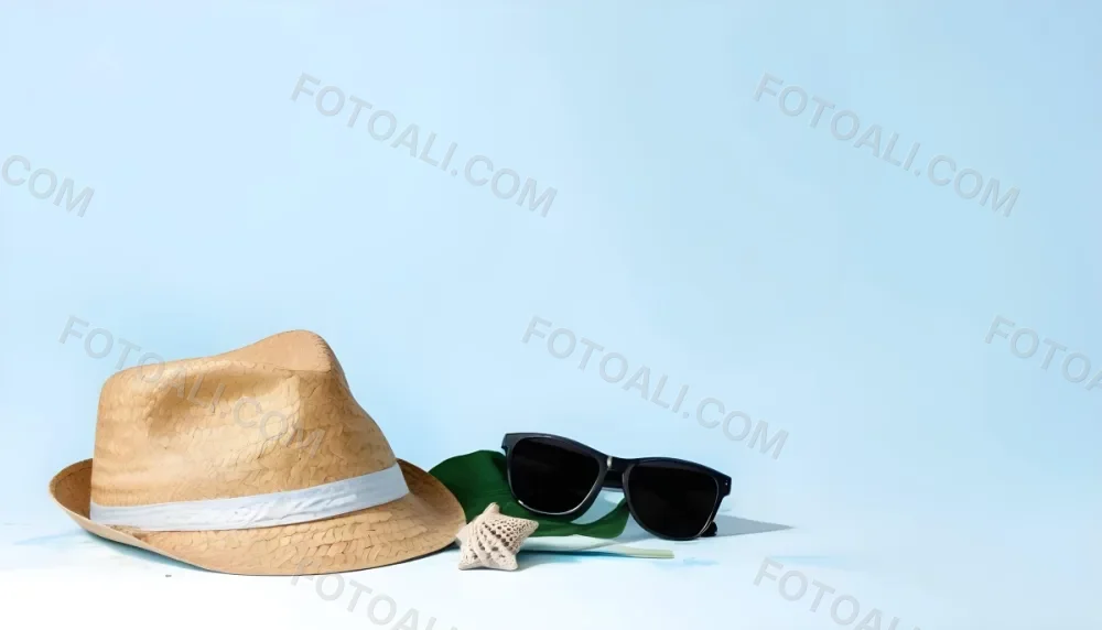 A Straw Hat With A Blue Ribbon Black Sunglasses A Seashell And A Seashell On A White Surface With A Light Blue Background 3 D291