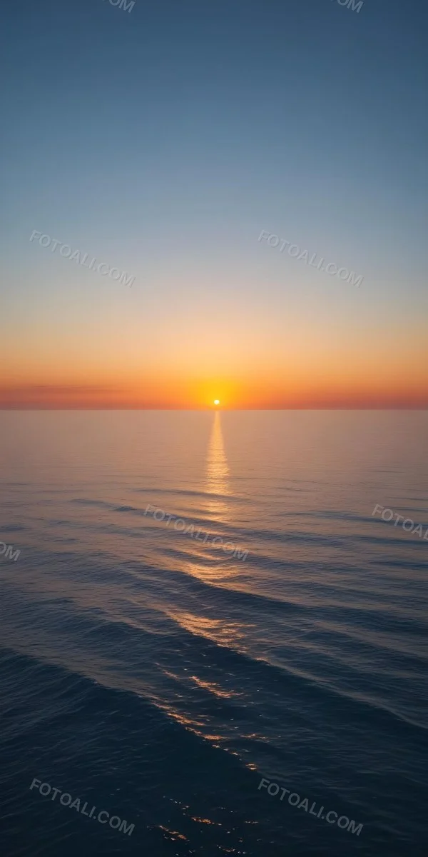 A Sunset Over The Ocean The Sky Is A Gradient Of Blue Orange And Yellow The Sun Is Setting On The Horizon 3 A297