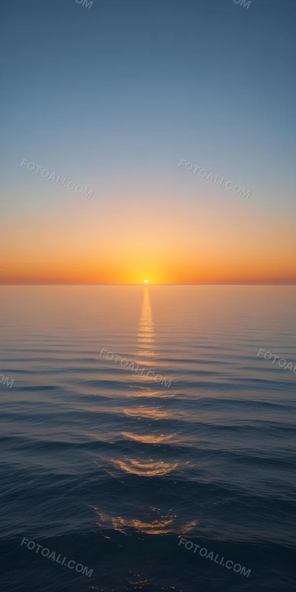 A Sunset Over The Ocean The Sky Is A Gradient Of Blue Orange And Yellow The Sun Is Setting On The Horizon 6 C44a