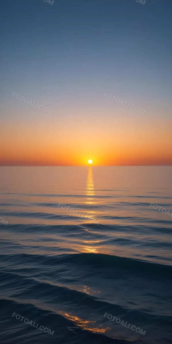 A Sunset Over The Ocean The Sky Is A Gradient Of Blue Orange And Yellow The Sun Is Setting On The Horizon 8 027c