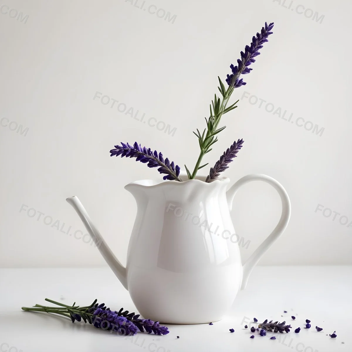 A White Ceramic Pitcher With A Sprig Of Lavender In It Another Sprig Of Lavender Is Lying On The White Surface 20 B896