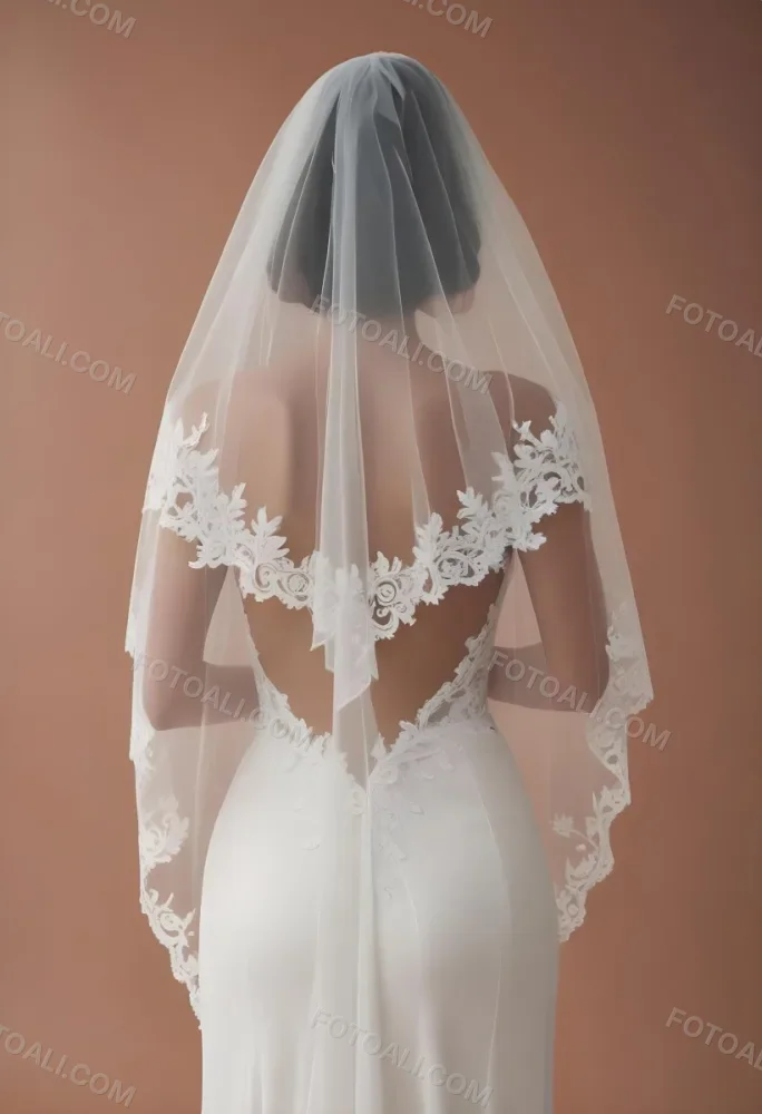 A White Wedding Dress With A Long Flowing Veil Featuring Lace Detailing 28 0cd4
