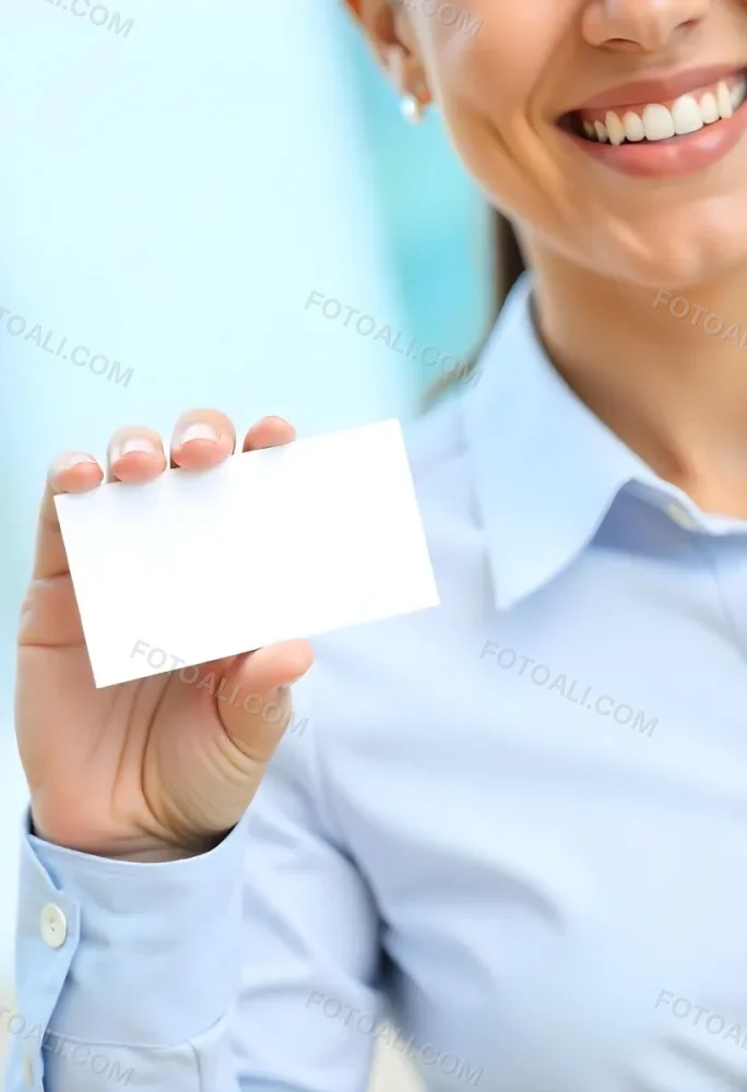 A White Woman Age 35 With A Blue Shirt Holding A Blank Business Card With A Bright Background 7 6a44