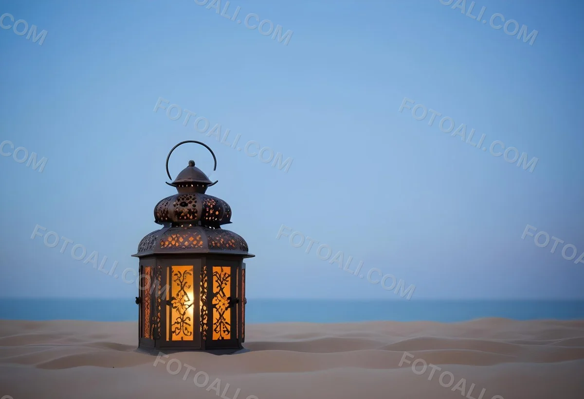 An Ornate Metal Lantern With Intricate Floral Cutouts Casting A Warm Glow On A Sandy Surface Against A Soft Gradient Blue Background 21 37c1