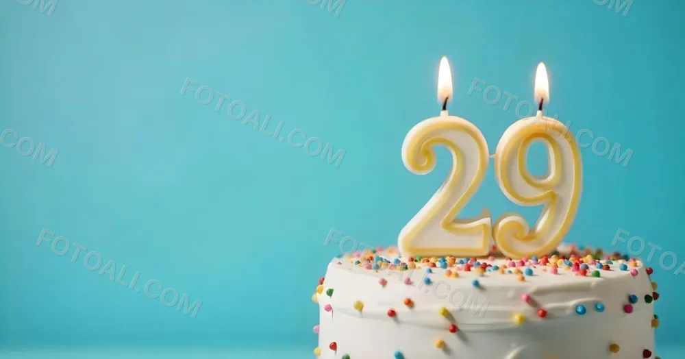 Birthday Cake With White Frosting And Colorful Sprinkles A Candle In The Shape Of The Number 29 Light Blue Background 16 6f06