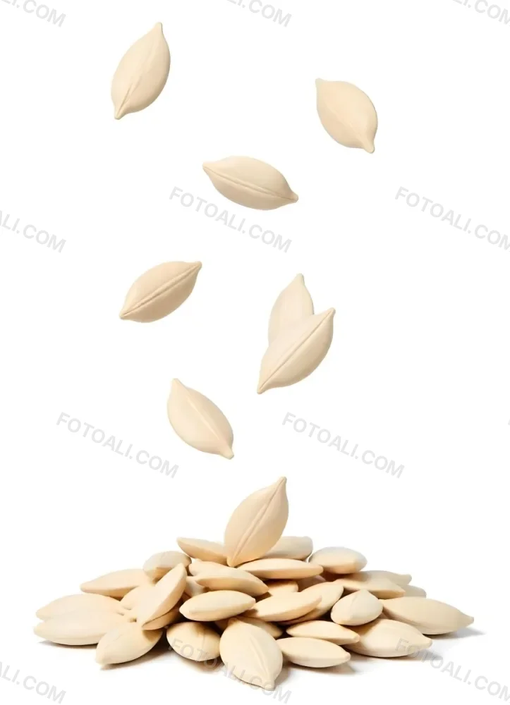 Pumpkin Seeds Falling Into A Pile Of Pumpkin Seeds Isolated On A White Background 16 9388