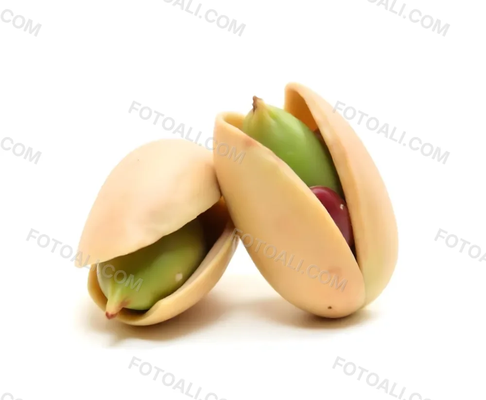 Two Pistachios One Closed And One Open Revealing The Green Nut Inside On A Green Background 20 5180