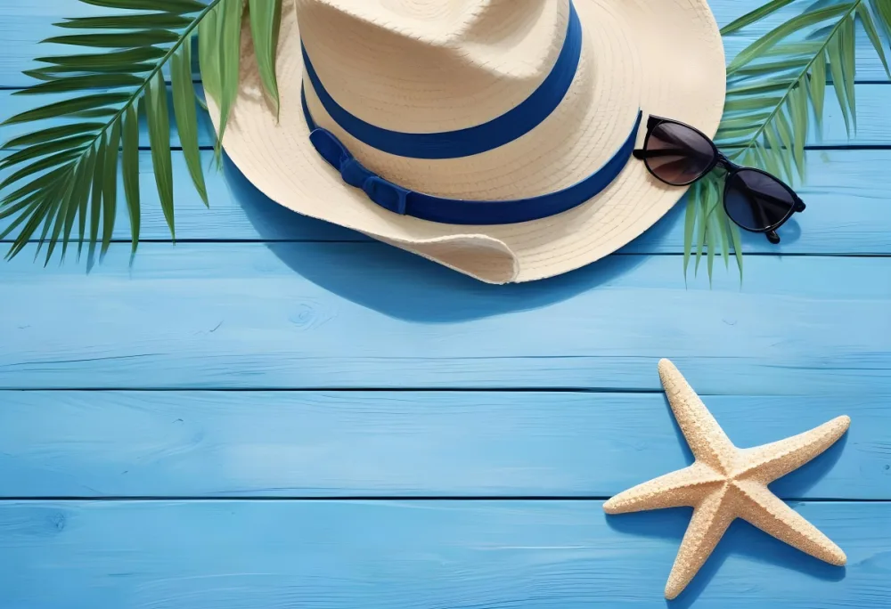 A Blue Hat With Sunglasses A Starfish And A Palm Leaf On A Blue Wooden Table Summer Vacation Concept Top View 16 D89d