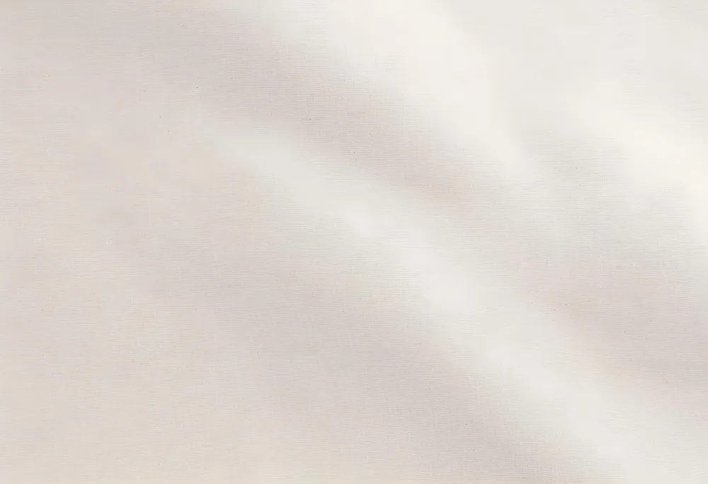 A Close Up View Of A Light Colored Textured Fabric Featuring Subtle Wrinkles And A Soft Natural Appearance The Fabric Has A Neutral Tone Likely Beige With A Slightly Uneven Surface 18 5643