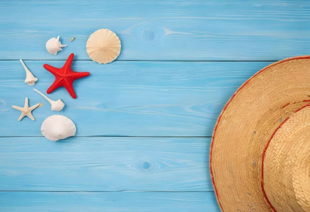 A Red Starfish Seashells And A Straw Hat On A Blue Wooden Background Summer Vacation Concept Beach Theme Top View Flat Lay 17 3ec0