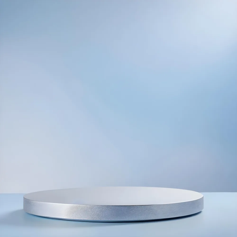 A Stack Of Silver Metal Plates Or Discs On A Light Blue Background 6