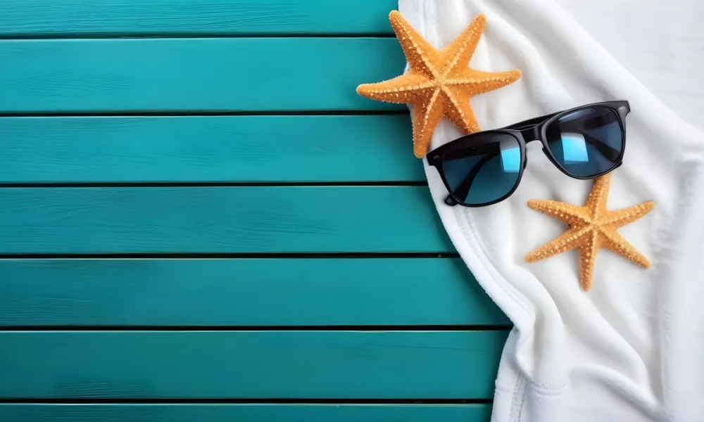 A Starfish And Sunglasses On A White Towel On A White Wooden Surface Beach Vacation Concept Summer Vacation Tropical Bright Colors High Angle View 4 B1a4