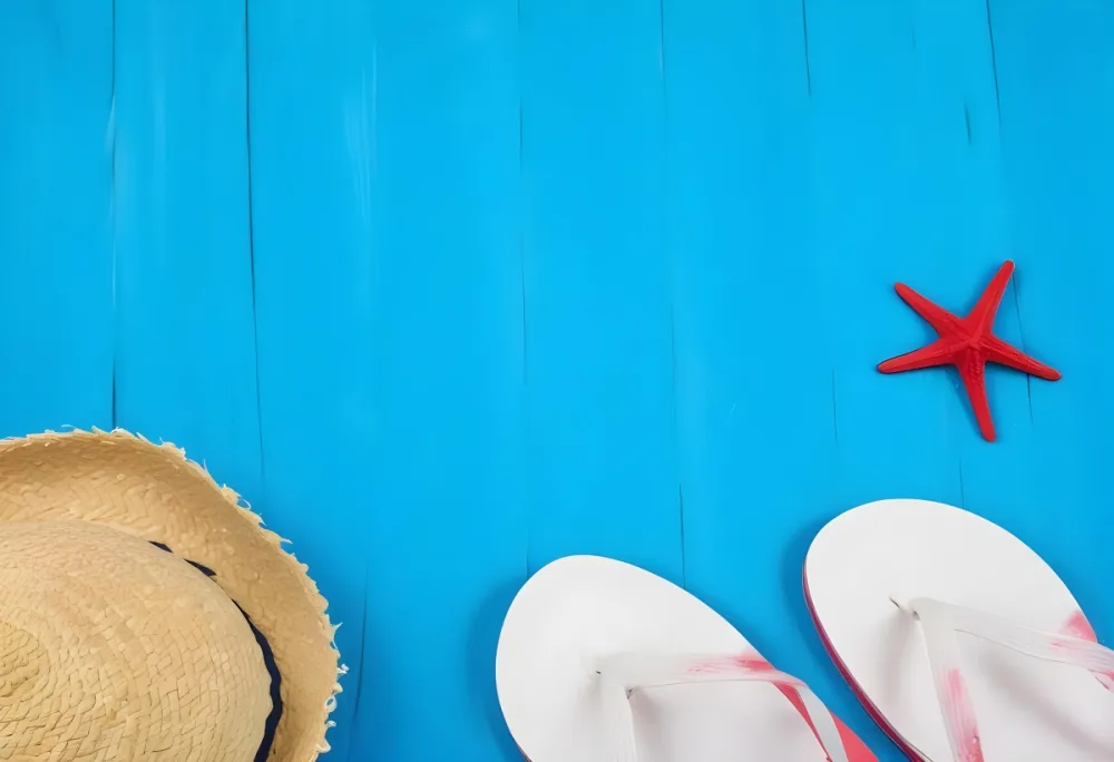 A Straw Hat A Pair Of Blue Flip Flops And A Blue Starfish On A Red Wooden Surface Summer Vacation Concept Beach Background Travel And Leisure 23 5408