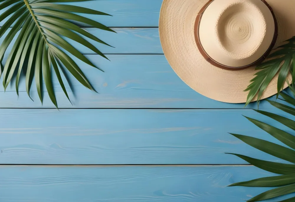 A Straw Hat And A Palm Leaf On A Blue Wooden Surface With Sand Creating A Summery And Beachy Vibe Top View 13 F1d2