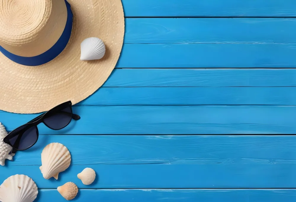 A Straw Hat With A Blue Ribbon Sunglasses And Seashells On A Blue Wooden Surface Summer Vacation Concept Beach Accessories Top View Flat Lay 3 0129