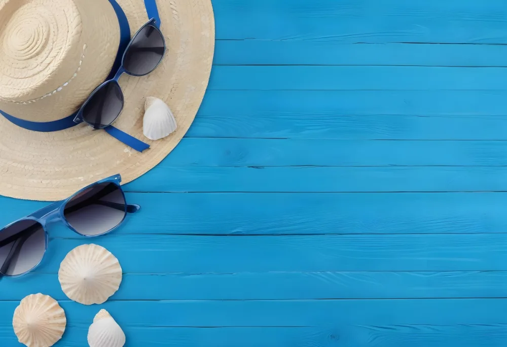 A Straw Hat With A Blue Ribbon Sunglasses And Seashells On A Blue Wooden Surface Summer Vacation Concept Beach Accessories Top View Flat Lay 33 A107