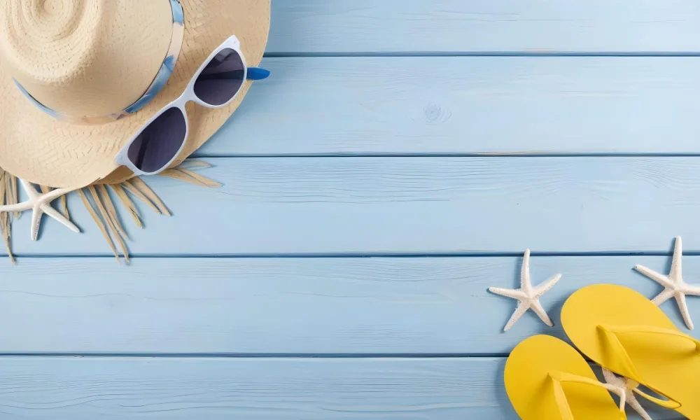 A Straw Hat With Sunglasses A Starfish And Blue Flip Flops On A Blue Wooden Surface 7 1346