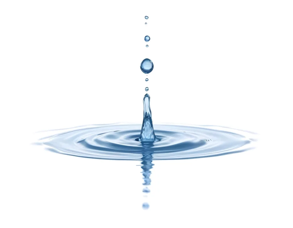 A Water Drop Falling Into A Body Of Water Creating Ripples Isolated On A White Background Studio Shot High Speed Photography 9 6a5e