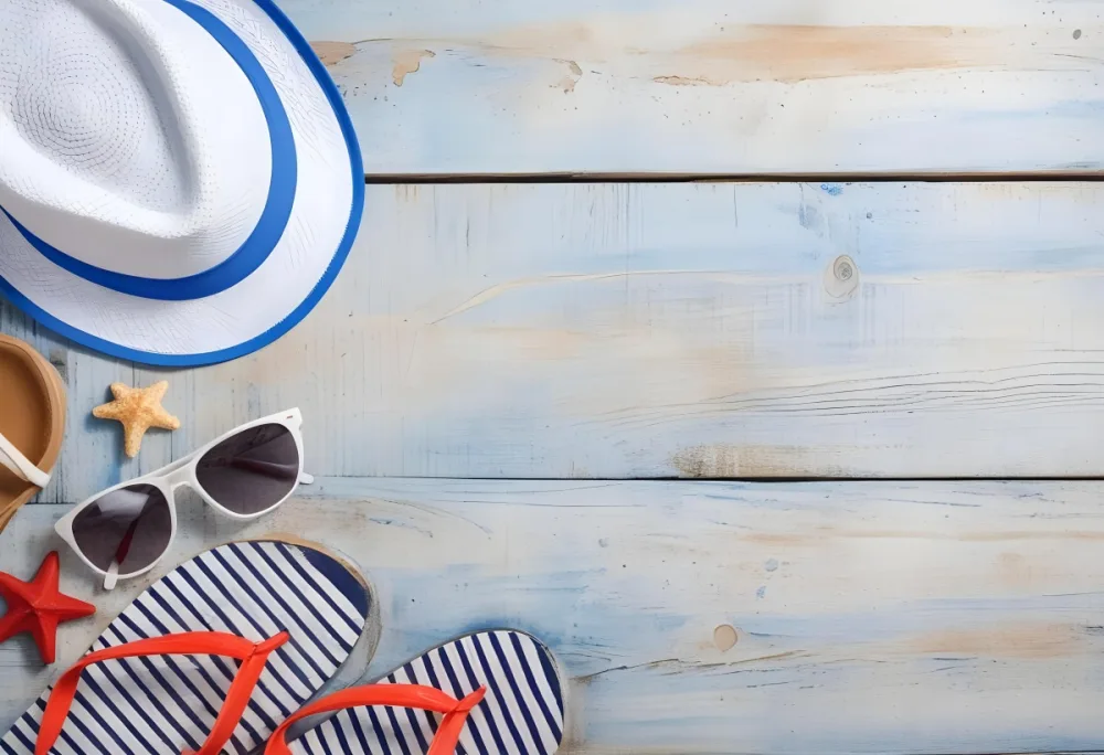A White Hat With A Blue Stripe Sunglasses And Flip Flops On A Blue Wooden Surface Summer Vacation Concept Top View Flat Lay 11 38dd