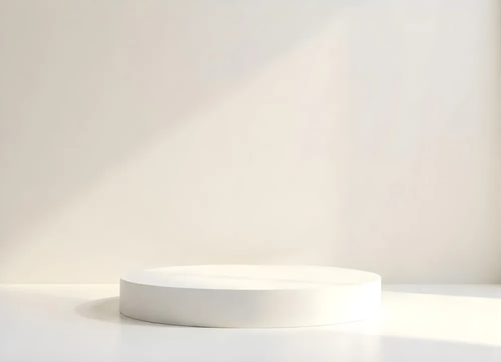 A White Podium On A White Surface The Background Is A Beige Wall Product Display Minimalist Design Clean Presentation Soft Lighting Studio Setting 11 176b