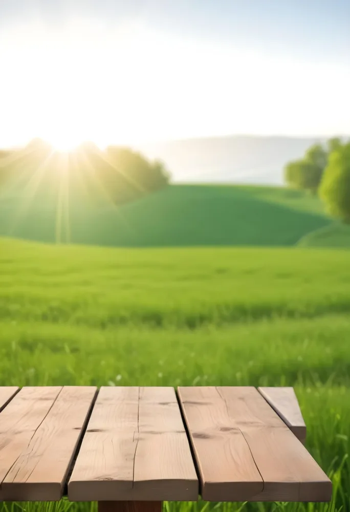 A Wooden Table With A Green Field In The Background The Sun Is Shining And The Sky Is Clear The Grass Is Green And Lush 57 Cac7